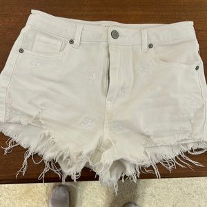 White denim shorts with stars